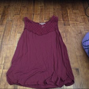 Red top with lace detailing at the neckline